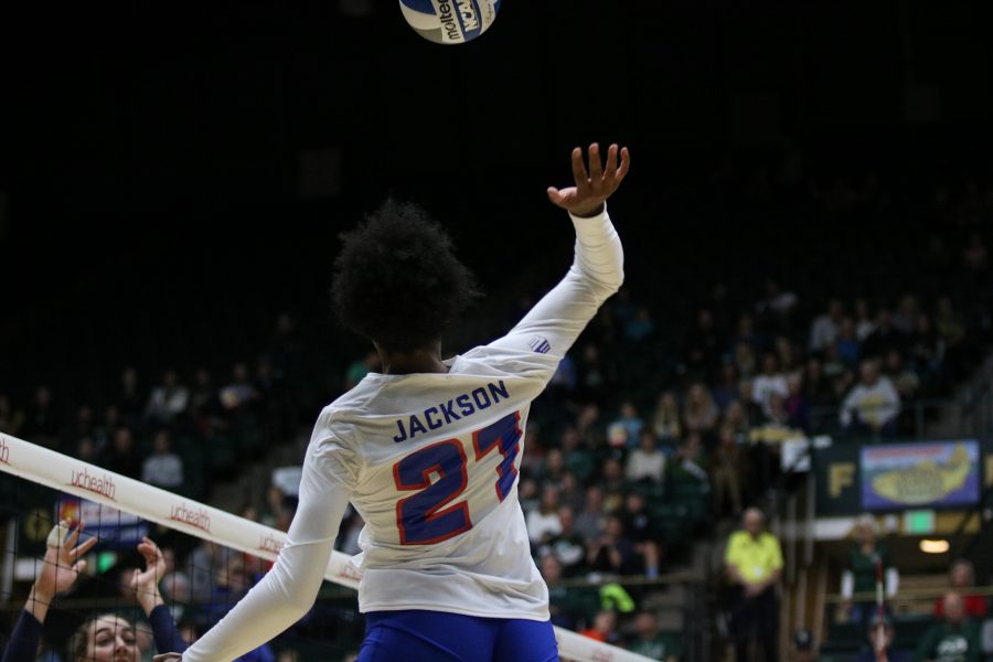 Jessica Jackson(21) spikes the ball on to the Utah State side for a CSU point. (Devin Cornelius | Collegian)
