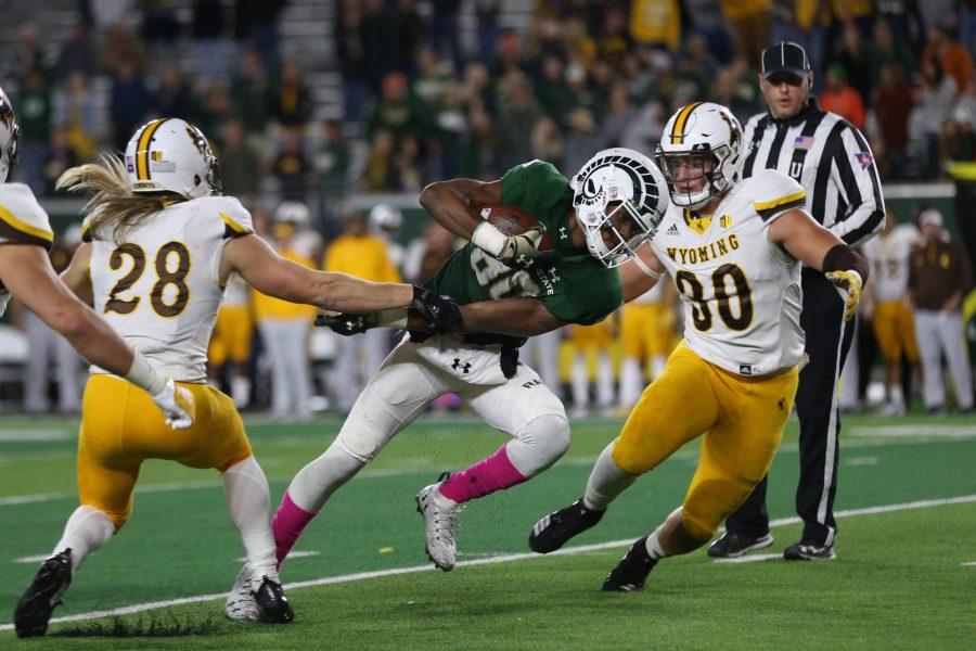 Wide Receiver Nikko Hall battles for more yards during the second half of play against the University of Wyoming on Oct 26. (Elliott Jerge | Collegian)