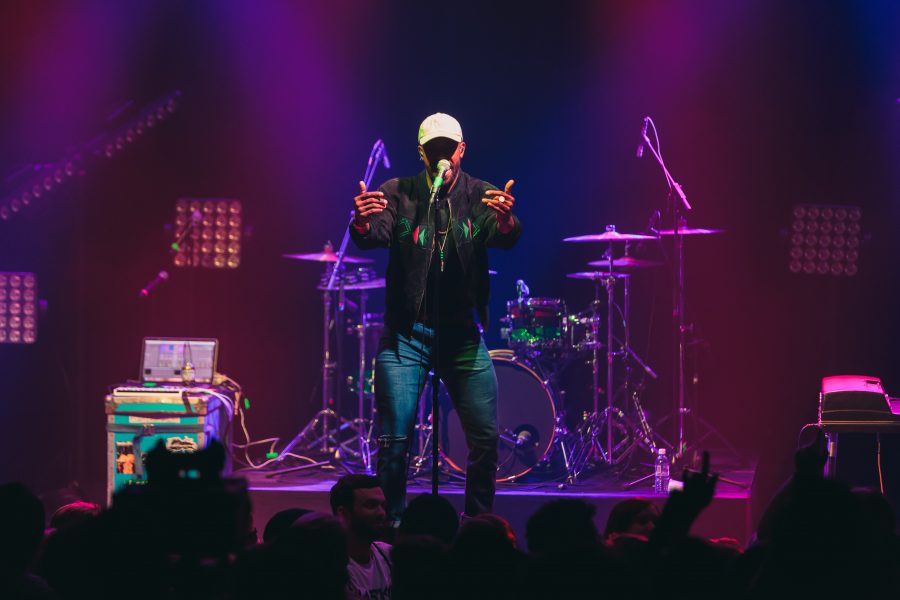 Watsky opener and drummer Chukwudi Hodge performs on stage at the Fox Theater in Boulder on Oct. 28. (Davis Bonner | Collegian)
