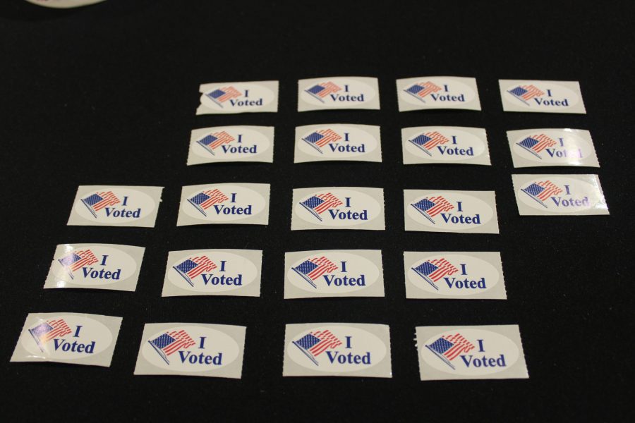 Voting stickers lay on a table outside of the North Ballroom in the Lory Student Center for voters to take after they have summited their ballot. (Matt Begeman | Collegian)