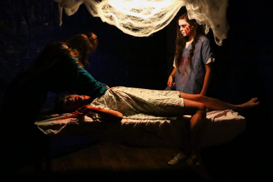 Actors create a hospital scene in CSU fraternity Theta Chi's haunted house. The theme of this year's haunted house is 