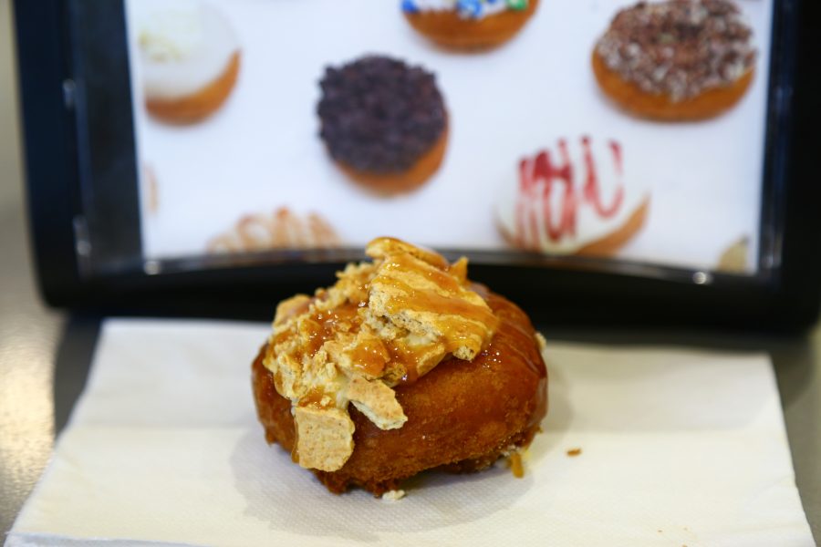 Pumpkin cheesecake is one of three fall offerings from Peace Love and Little Donuts this season. (Davis Bonner | Collegian)