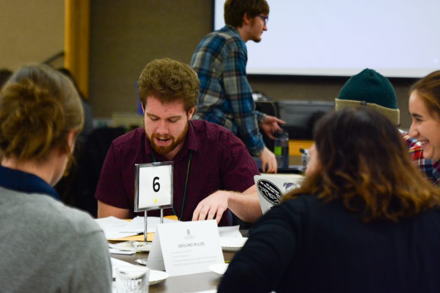 Jackson Perez, a student from Colorado State University leading a group discussion along with other CSU students. (Mackenzie Boltz | Collegian)