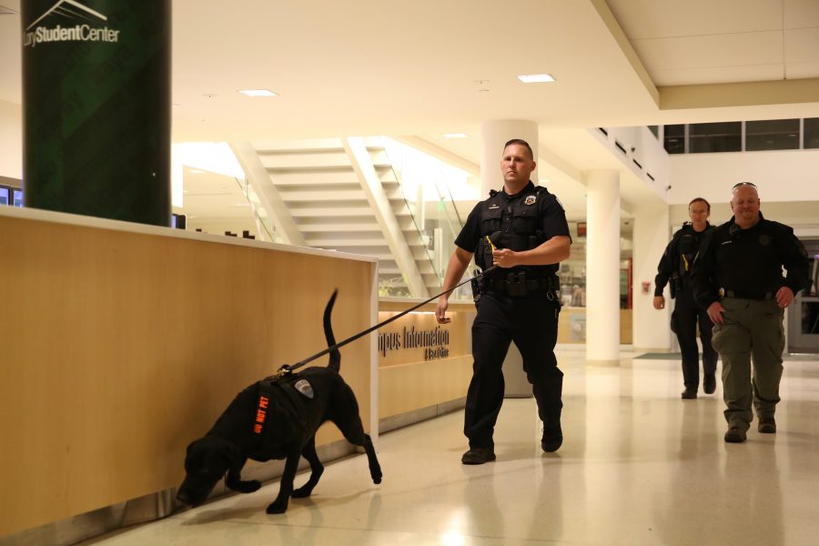 Police officers work a K9 unit through the LSC prior to Dennis Prager's appearance on Oct. 29, 2018. (Forrest Czarnecki | Collegian)