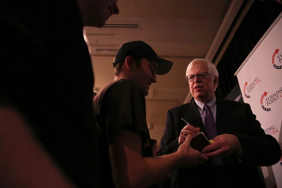 Conservative radio talk show host Dennis Prager, right, chats with Tyler Hanson, left, following his speech on campus on Oct. 29, 2018. (Forrest Czarnecki | Collegian)