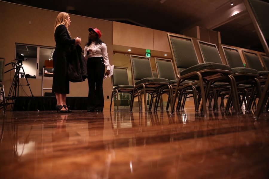 Shekinah Geist, right, speaks with a reporter who said she was with the Financial Times following Dennis Prager's speech on campus on Oct. 29, 2018. (Forrest Czarnecki | Collegian)