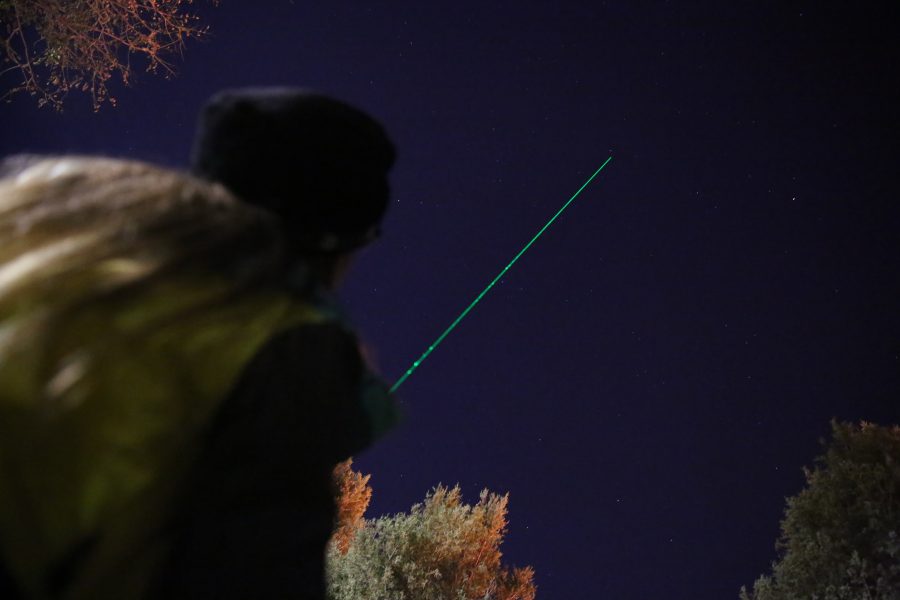 Heather Michalak uses a laser pointer to outline specific stars and constellations during an open house event at the Madison-McDonald Observatory on campus on Oct. 19, 2018. (Forrest Czarnecki | Collegian)