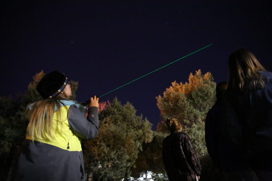 Heather Michalak uses a laser pointer to outline specific stars and constellations during an open house event at the Madison-McDonald Observatory on campus on Oct. 19, 2018. (Forrest Czarnecki | Collegian)