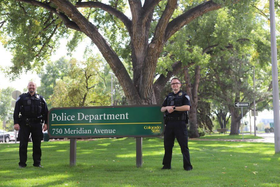 Officer Matt Snyder and Officer Steven Eckelberry stand in front of the Colorado State University Police Department. CSUPD provides services on campus like SafeWalk, bike safety enforcement, and ride along programs. (Brooke Buchan | Collegian) 