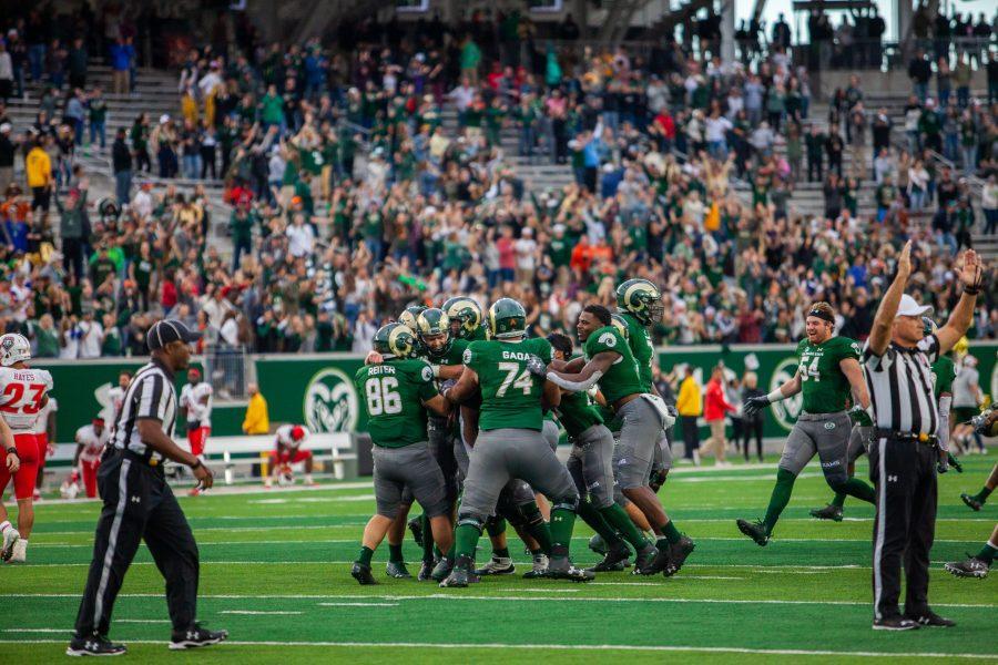 CSU football players cheer after their victory during the Homecoming Game against the New Mexico Lobos on Oct. 13. The Rams won 20-18. (Natalie Dyer | Collegian)