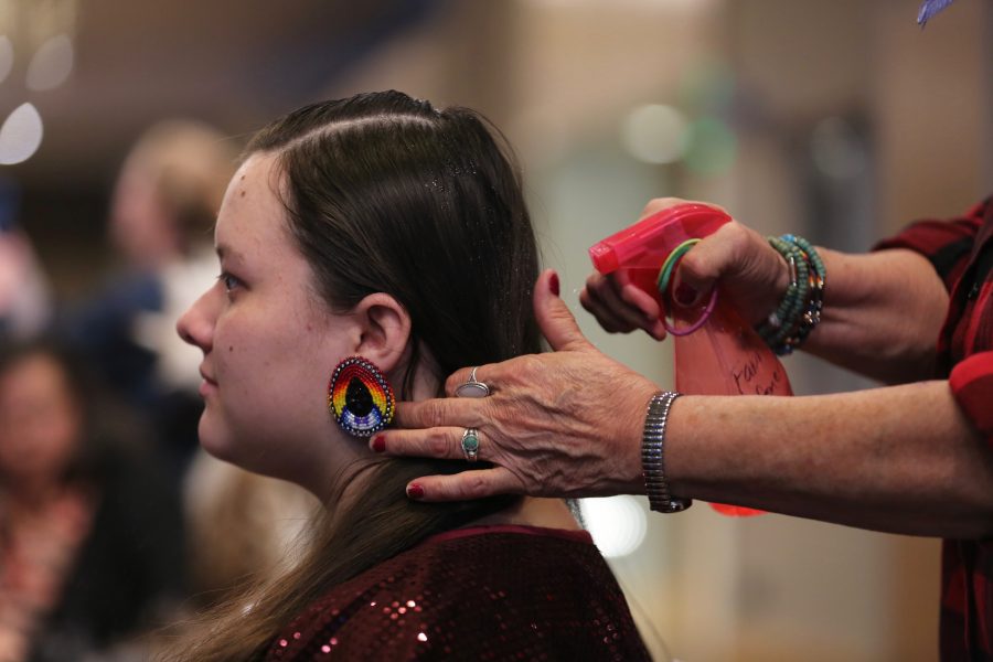 Diane Yankton braids her granddaughter, Morning Star Yazzie's, hair at the 36th annual AISES Pow Wow at the LSC on Nov. 3, 2018. (Forrest Czarnecki | Collegian)
