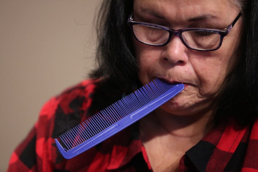 Diane Yankton braids her granddaughter, Morning Star Yazzie's, hair at the 36th annual AISES Pow Wow at the LSC on Nov. 3, 2018. (Forrest Czarnecki | Collegian)