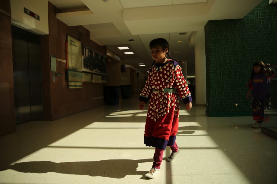 Cordelia Jumping Eagle walks to the grand ballroom before the grand entry begins at the 36th annual AISES Pow Wow at the LSC on Nov. 3, 2018. (Forrest Czarnecki | Collegian)