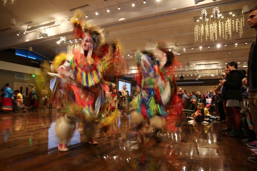 Stanley Aschenbrenner, left, and Scott Murphy, right, move through the grand ballroom as part of the grand entry at the 36th annual AISES Pow Wow at the LSC on Nov. 3, 2018. (Forrest Czarnecki | Collegian)
