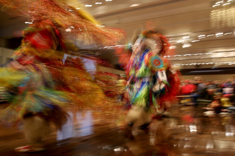 Stanley Aschenbrenner, left, and Scott Murphy, right, move through the grand ballroom as part of the grand entry at the 36th annual AISES Pow Wow at the LSC on Nov. 3, 2018. (Forrest Czarnecki | Collegian)