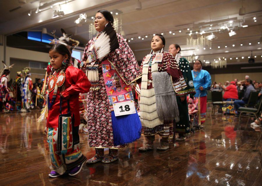The grand entry moves through the grand ballroom at the 36th annual AISES Pow Wow at the LSC on Nov. 3, 2018. (Forrest Czarnecki | Collegian)