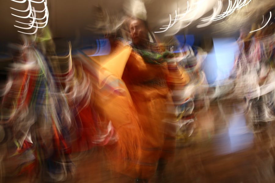 A woman moves through the grand ballroom as part of the grand entry at the 36th annual AISES Pow Wow at the LSC on Nov. 3, 2018. (Forrest Czarnecki | Collegian)