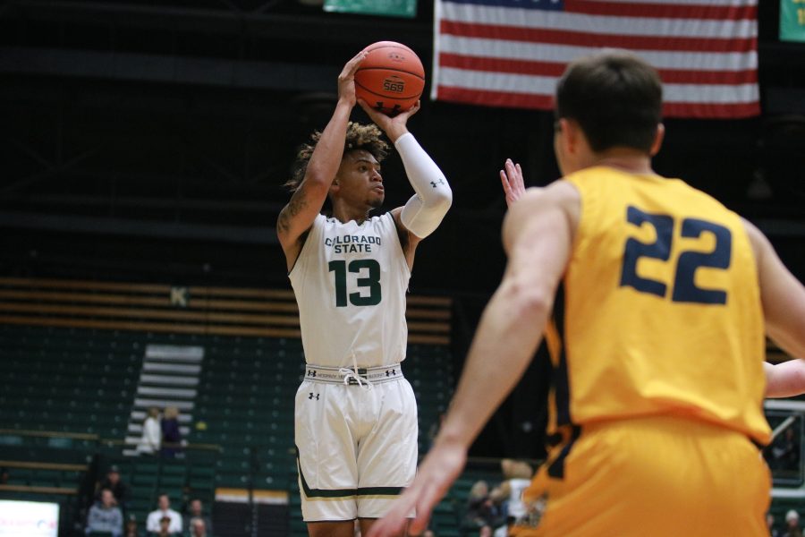 Lorenzo Jenkins (13) Shoots from three during the Rams game vs CCU. Rams win 100-63. (Devin Cornelius | Collegian)