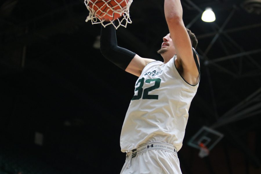 Nico Carvacho (32)slams the ball down into the net while playing against UAPB. The Rams win 92-67. (Devin Cornelius | Collegian)