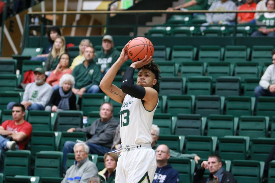 Lorenzo Jenkins (13) pulls up at the three point line and shoots during CSU's game against UAPB. The Rams win 92-67. (Devin Cornelius | Collegian)