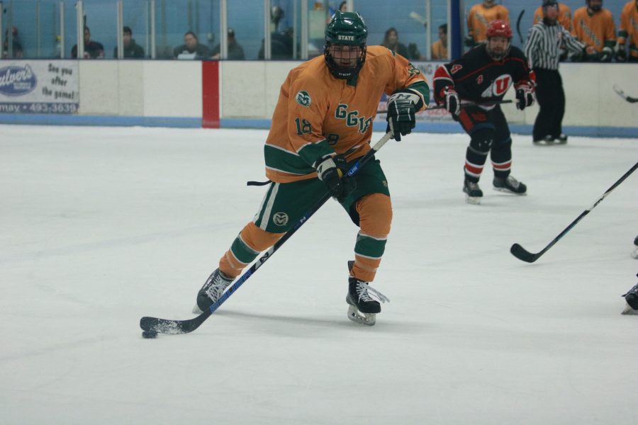 Austin Ansay (18) passes the puck to a teammate as the Rams fight against the Utes. The Rams win 6-3 (Devin Cornelius | Collegian)