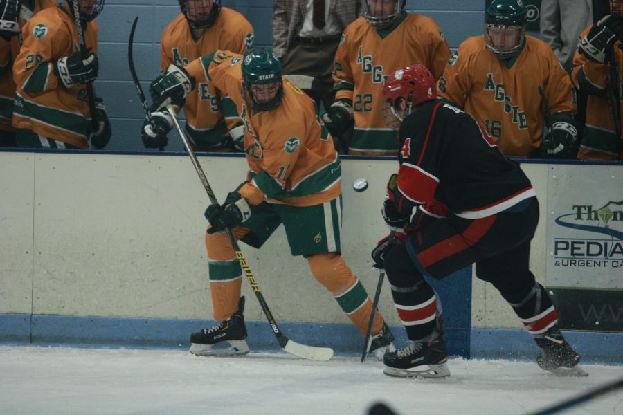 Tito Moreno (11) knocks the puck up into the air while battling a Utah defender. The Rams beat the Utes 6-3.(Devin Cornelius | Collegian)