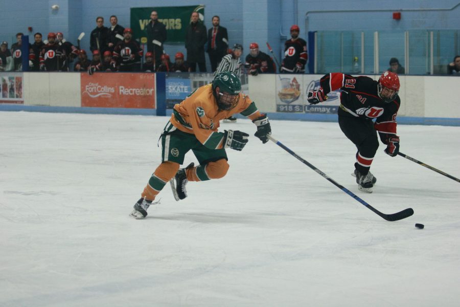 Liam Millar (15) races to beat the Utah defender down the rink. The Rams beat the Utes 6-3. (Devin Cornelius | Collegian)