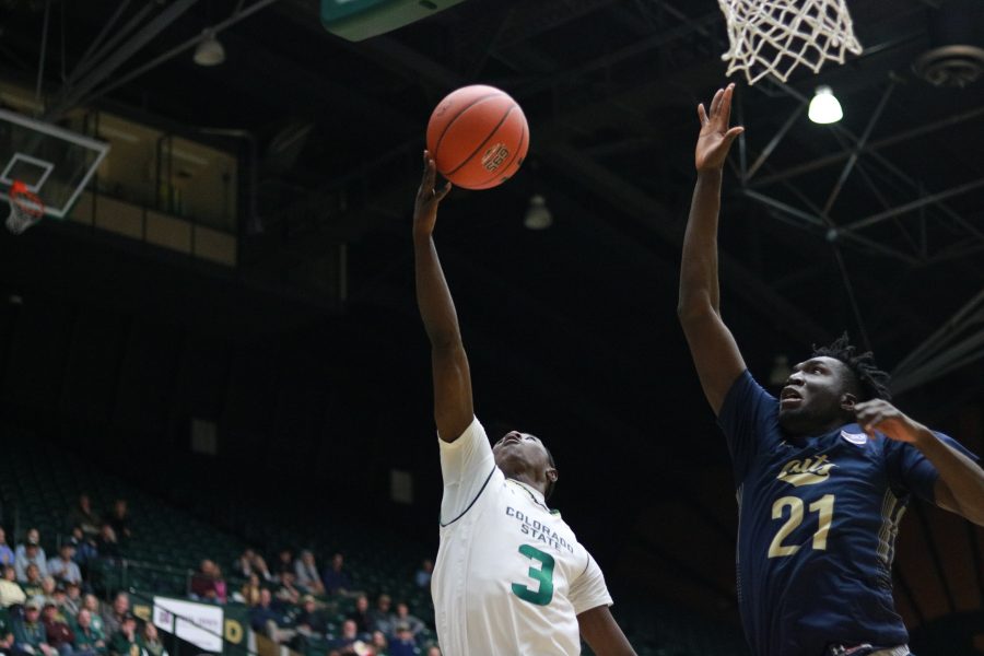 Kendle Moore (3) shoots a behind the back layup while being defended by a MSU player. CSU defeats MSU 81-77.(Devin Cornelius | Collegian)