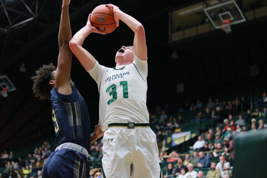 Adam Thistlewood (31) drives up towards the basket while being defended by a MSU player. The rams beat the bobcats 81-77.(Devin Cornelius | Collegian)