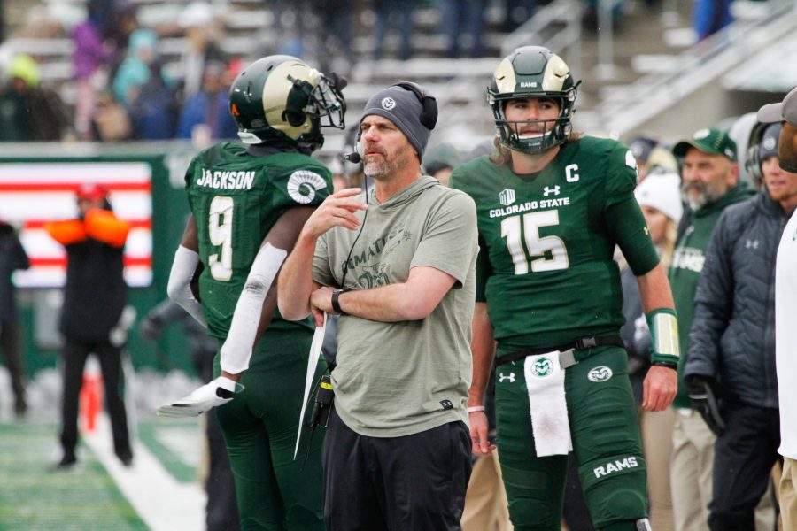 Mike Bobo and Collin Hill watch from the sidelines during the game against Utah State. (Ashley Potts | Collegian)