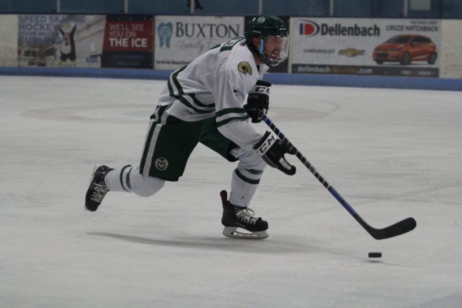 John Tower (7) drives down the ice rink during the CSU vs. CU hockey game. The Rams lost to the Buffaloes 3-2 in the last 30 second of overtime. (Matt Begeman | Collegian)