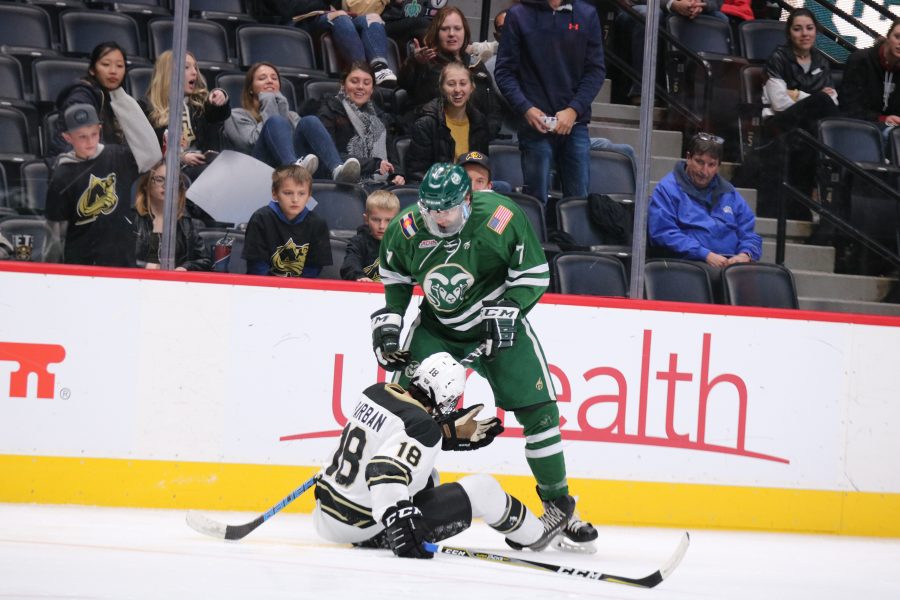 John Tower (7) knocksdown a CU player after his stick gets stuck to the other player, during CSU's game against CU. The Rams fall to the Buffs 8-3. (Devin Cornelius | Collegian)