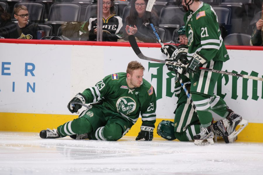 Austin Ansay (29), Tyler Nelson(12) and Ben Joseph celebrate after Ansay scores against CU at the Pepsi Center. The Rams lose 8-3.(Devin Cornelius | Collegian)