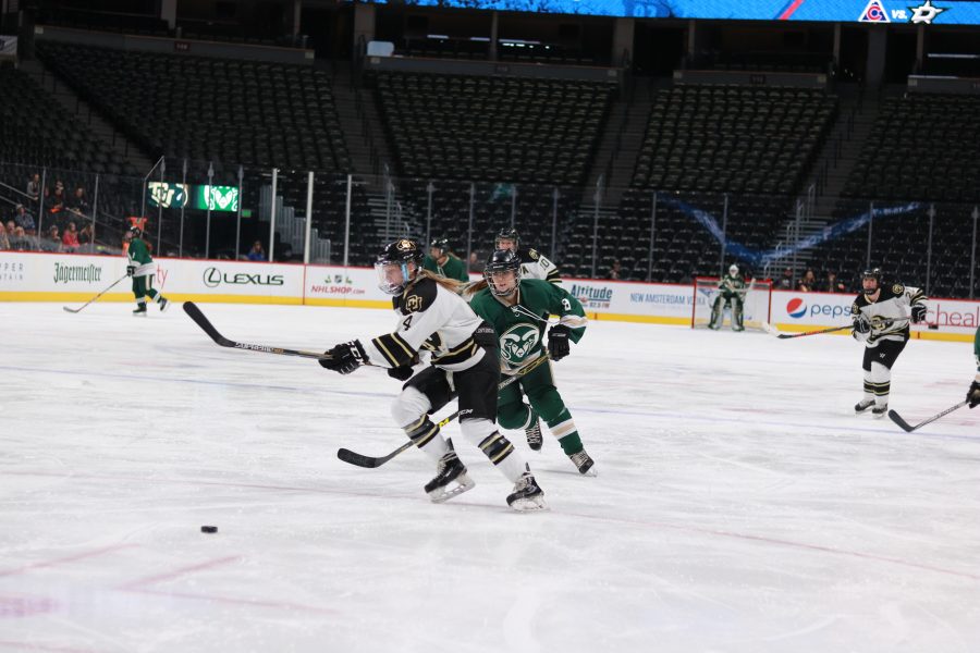 Megan Johnston(8) chases the puck as the lady rams battle the lady buffs. The rams lose 9-0. (Devin Cornelius | Collegian)