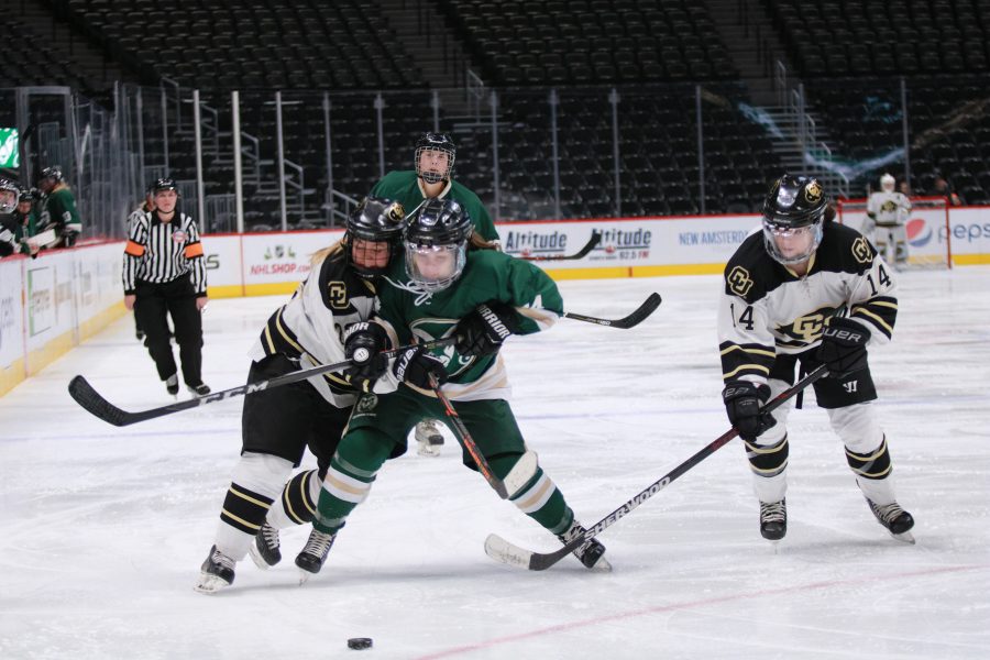 Sarah Watler (24) battles CU players for possession of the puck as the Rams battle the Buffs. Rams lose 9-0. (Devin Cornelius | Collegian)