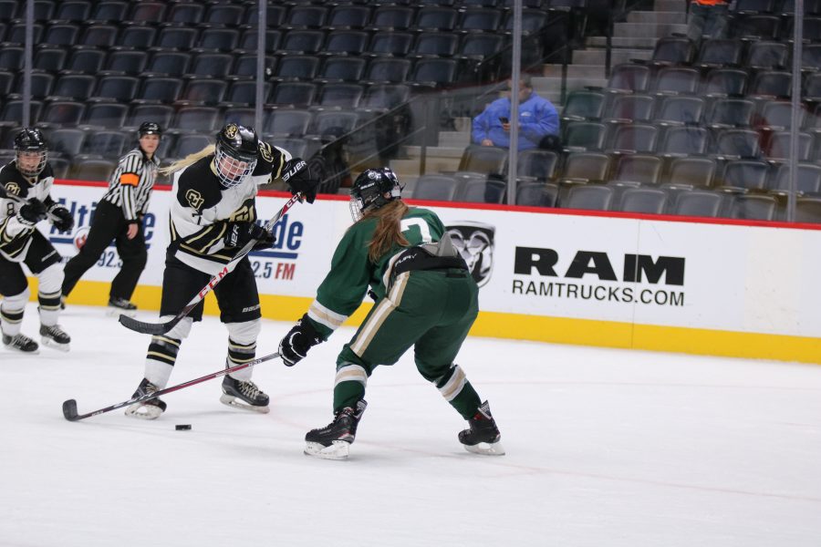 Alyssa Schmidt (7) takes the puck from a CU player as the Rams take on the Buffs at the Pepsi Center.  Rams lose 9-0. (Devin Cornelius | Collegian)
