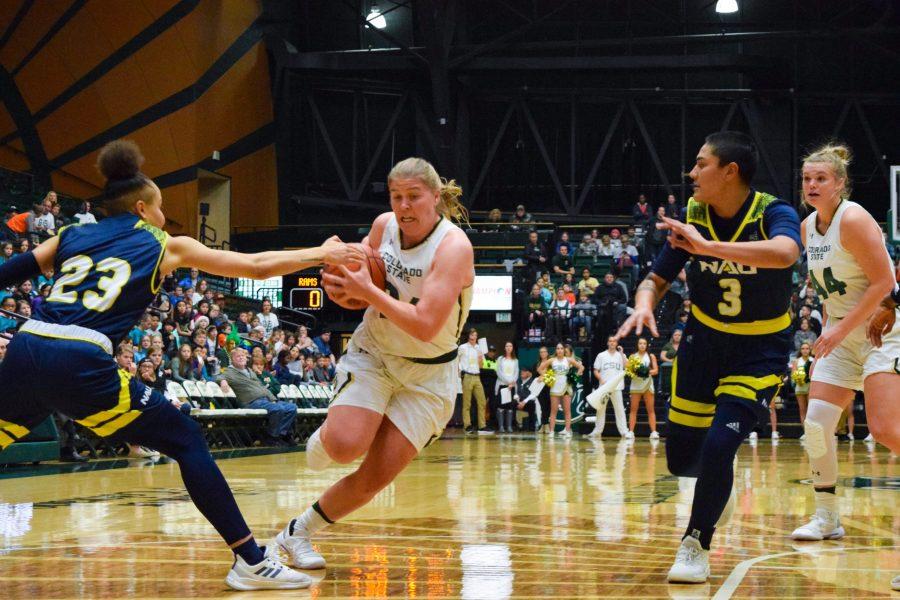 Mollie Mounsey fights off several Northern Arizona players on her way down the court Dec. 5. The Rams won 64-54. (Alyse Oxenford | Collegian)