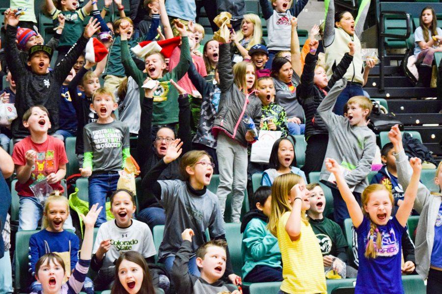 A loud card of elementary school students from Poudre County cheers on the Rams women's basketball team against NAU on December 5, 2018. (Alyse Oxenford | Collegian)