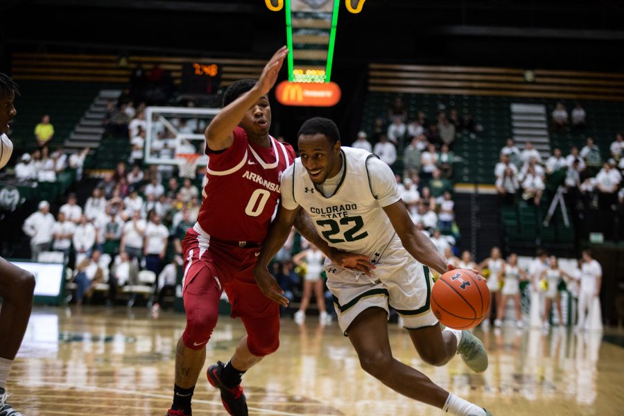 J.D. Paige (22) drives towards the net during the game against the Razorbacks on December 5, 2018. Both teams played aggresive strategies throughout the game, but the Razorbacks ended up winning 74-98, making CSUs record 4-5. (Josh Schroeder| Collegian)