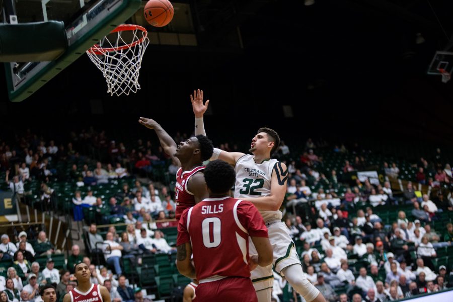 Nico Carvacho (32) tries for the rebound against two Razorback players during the wednesday game. The game, held on December 5, 2018 saw the sixth straight win for the Razorbacks. (Josh Schroeder | Collegian)
