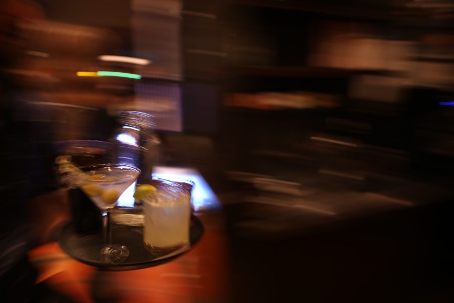 Drinks are taken out to a table at Nick's Italian restaurant on Jan. 23. Nick's was holding an event where federal employees could receive a free meal with a valid government ID. (Forrest Czarnecki | Collegian)