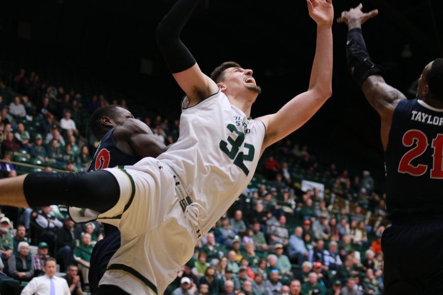Nico Carvacho (32) leaps up for the ball during CSU's home game vs FSU. The Rams come out on top 75-64. (Devin Cornelius | Collegian)