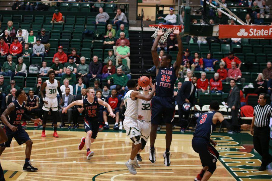 Hyron Edwards (0) passes the ball to Nico Carvacho (32) during CSU's home game against FSU. The Rams win 75-64 .(Devin Cornelius | Collegian)
