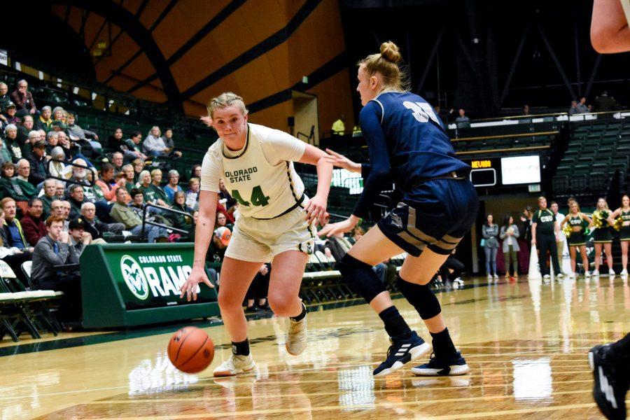 Tatum Neubert dribbles the ball down the court in the January 23 2019 game against University of Nevada. (Alyse Oxenford | Collegian)