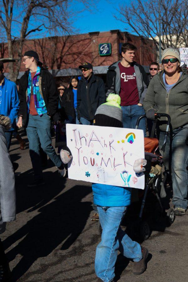 Young boy holding a sign at the annual Fort Collins Martin Luther King Jr. Day march. 
(Anna von Pechmann | Collegian) 