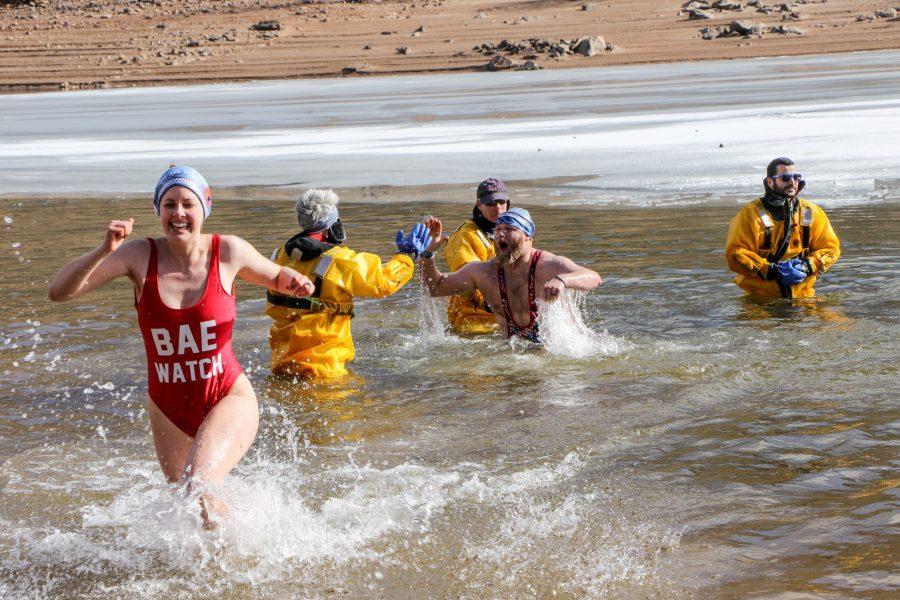 Plunge participants in Horsetooth Reservoir as Larimer County Dive Rescue Team guards. Courtesy of Green Events Colorado