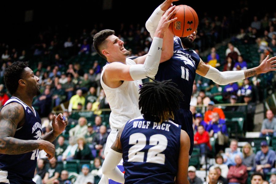 Nico Carvacho attempts a shot through the Wolfpack defense during the game against No. 6 Nevada Feb. 6. (Ashley Potts | Collegian)