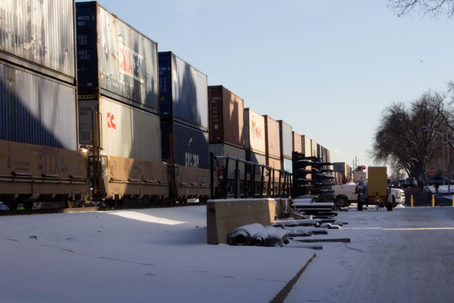 A stopped freight train sits near the intersection of Mason and Laurel streets following a train and pedestrian collision at 2:57 p.m. Feb. 7. One fatality was confirmed by Fort Collins Police Services. (Austin Fleskes | Collegian)