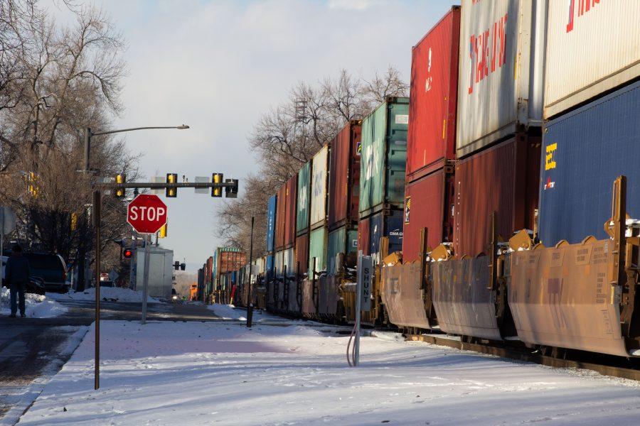 A stopped freight train sits near the intersection of Mason and Laurel streets following a train and pedestrian collision at 2:57 p.m. Feb. 7. One fatality was confirmed by Fort Collins Police Services. (Austin Fleskes | Collegian)