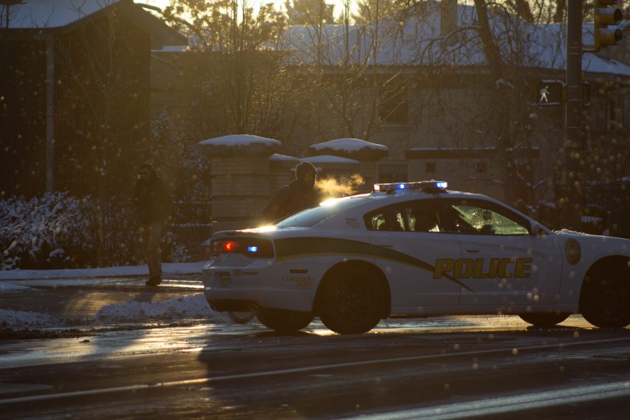 A Fort Collins police officer blocks Laurel street following following a train and pedestrian collision at 2:57 p.m. Feb. 7. One fatality was confirmed by Fort Collins Police Services. (Austin Fleskes| Collegian)